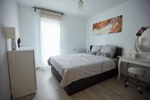 Appartements Appartement adorable et jardin : photos des chambres