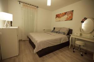 Appartements Appartement adorable et jardin : photos des chambres