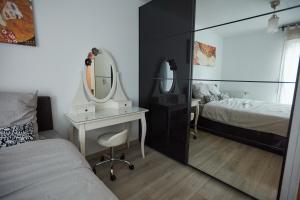 Appartements Appartement adorable et jardin : photos des chambres