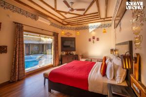 StayVistas Majestic Mud House - Rajasthani Architecture with Modern Amenities, Outdoor Pool, Adventure Activities, and Spa