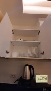 Condo in McKinley Hill near Grand Canal Mall (Balai Bellini)