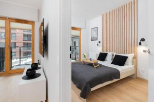 Modern White Apartments in Gdańsk with Balcony and Access to Gym by Renters