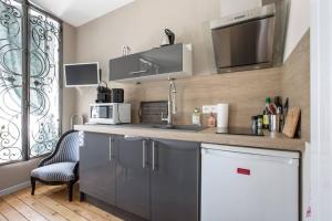 Appartements le 31 Au Coeur des Places : photos des chambres