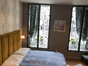 Appartements le 31 Au Coeur des Places : photos des chambres