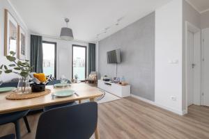 Subtle Grey Apartment with Furnished Balcony and Parking in Kraków by Renters