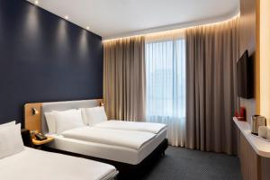 Standad Queen Room with Sofa Bed room in Holiday Inn Express Munich City West an IHG Hotel