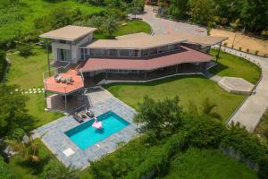 Bel Air Mansion by StayVista - A tranquil oasis with a spacious deck, Gazebo & A mini-amphitheatre