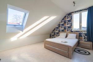 Appartements Santa Monica, maison spacieuse Reims Cormontreuil : photos des chambres