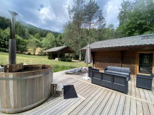 Chalets LE FISHING LODGE Chalet en bois avec bain nordique : photos des chambres