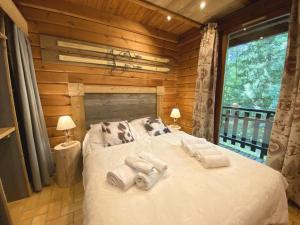 Chalets LE MONTAGNARD Chalet en bois : photos des chambres