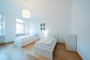 Apt Volt - Modern, neu, komplett ausgestattet, 4 Einzelbetten, zentral mit Waschmaschine Spülmaschine TV Herd Backofen Mikrowelle