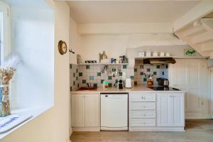 Maisons de vacances Escapade dans une belle longere a Penmarch : photos des chambres