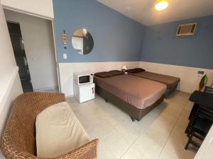 Remar Suítes 03 - Melhor localização do Guarujá, perto da praia e com ar condicionado!