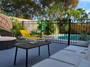 Prime Location Gateway with Pool & Patios, Near Beaches, Groceries and Restaurants