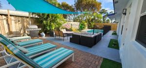 Prime Location Gateway with Pool & Patios, Near Beaches, Groceries and Restaurants