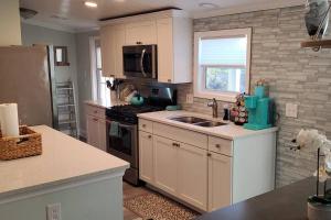 Waterfront home with private dock, walk to beach