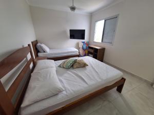 Apto em Bertioga , pé na areia