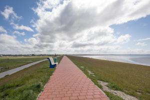 Direkt am Deich - Ferienwohnung Oland im Gästehaus Am Badedeich