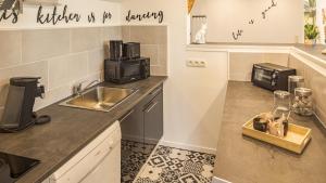 Appartements Riverside - Charme et Confort : photos des chambres