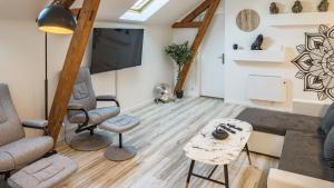 Appartements Riverside - Charme et Confort : photos des chambres