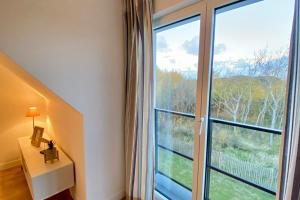 Maisons de vacances Cosy cottage for 4 people with access to the dunes : photos des chambres