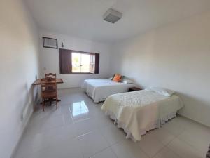 Mansão cinematográfica pé na areia