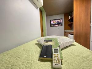 STUDIO aconchego, com Ar, Wifi, Smartv e Cozinha