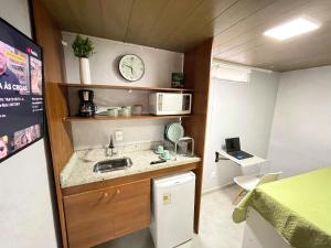 STUDIO aconchego, com Ar, Wifi, Smartv e Cozinha