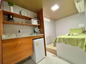 STUDIO aconchego, com Ar, Wifi, Smartv e Cozinha