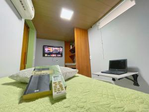 STUDIO aconchego, com Ar, Wifi, Smartv e Cozinha