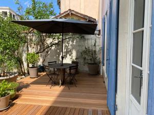 Appartements Un jardin en ville - Parking : photos des chambres