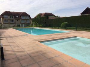 Apartment Green Garden 23 - 204 with shared pool by Interhome