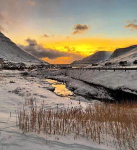 Experience unique Faroe Islands holiday home by the sea with great views, fully equipped kitchen and reliable Wi-Fi