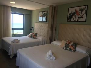 Flat Natal com vista para o mar