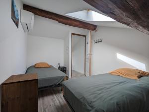 Appartements Le Cinoche, cocon sous les toits : photos des chambres