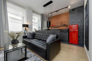 Exclusive Grey and Red Apartment in Warsaw Center by Renters