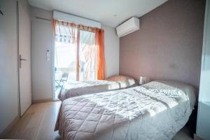 Appartements Le Central Vue Mer Clim Plage 2min Cosy Confort - Jetservices Conciergerie : photos des chambres