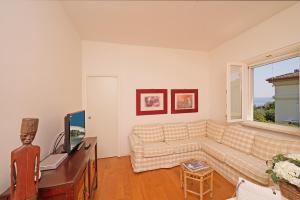 Villa Daniela con giardino privato recintato e barbecue, vicino alla spiaggia