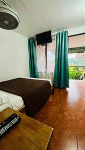 Hostal Nuevo Arenal downtown, private rooms with bathroom