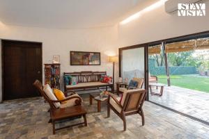 The Courtyard by StayVista - Private Pool with Rustic Charm, Vibrant Courtyard, Spacious Verandah & Garden