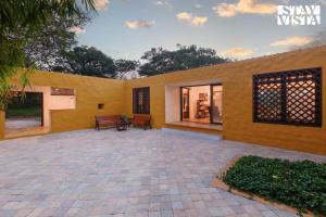 The Courtyard by StayVista - Private Pool with Rustic Charm, Vibrant Courtyard, Spacious Verandah & Garden