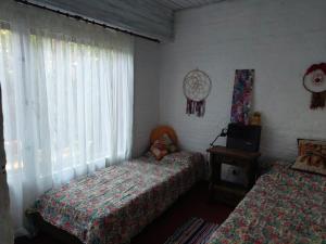 Habitación 1 dos camas individuales hermoso chalet zona golf