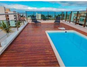 Flat com piscina a 200m da praia