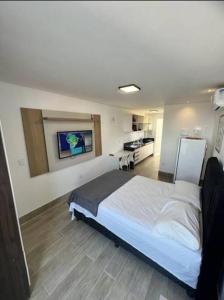 Flat com piscina a 200m da praia