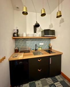 Appartements La boheme place aux herbes : photos des chambres