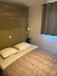 Campings Mobil home climatise 2 chambres : photos des chambres