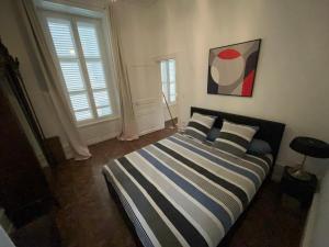 Appartements Centre-ville Aurillac 117m2 - Grande terrasse - 2 chambres - 2 grand lits - 1 canape lit : photos des chambres