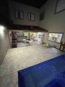 Casa com piscina Praia Grande. Carnaval disponivel