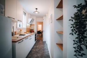 Appartements Le Bertrand • Le Raffinement en Coeur de Ville : photos des chambres