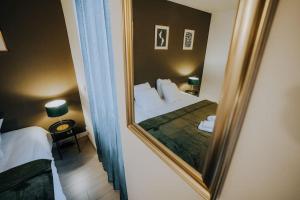 Appartements Le Bertrand • Le Raffinement en Coeur de Ville : photos des chambres